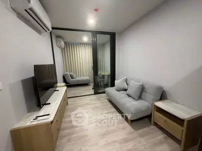 Modern living room with sleek furniture and air conditioning in a cozy apartment.