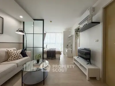 Modern open-plan living room with stylish decor and natural light