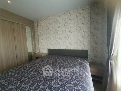 Cozy bedroom with modern design and natural light, featuring a comfortable bed and stylish decor.