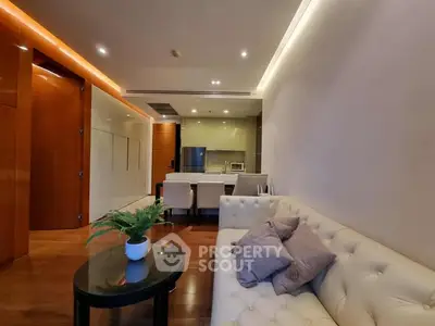 Modern living room with stylish furniture and open kitchen layout