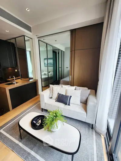 Modern living room with cozy sofa and stylish decor in open-plan apartment
