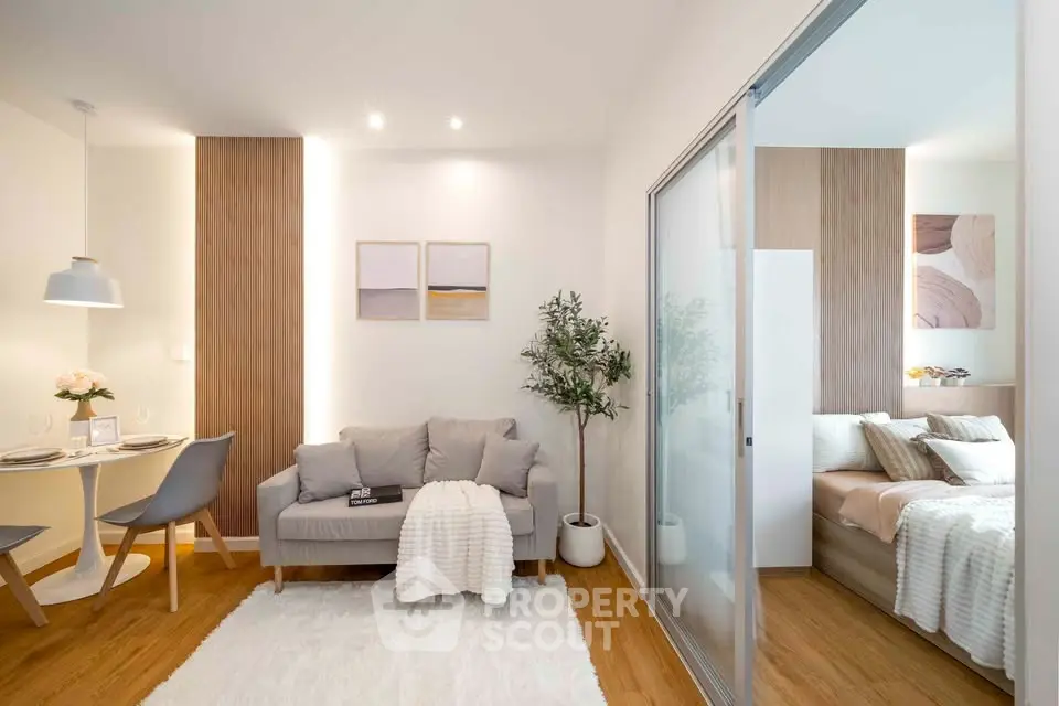 Modern open-plan living room with cozy bedroom and stylish decor