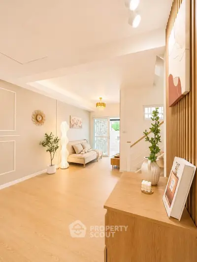 Spacious and elegantly designed living room with modern decor and natural light.