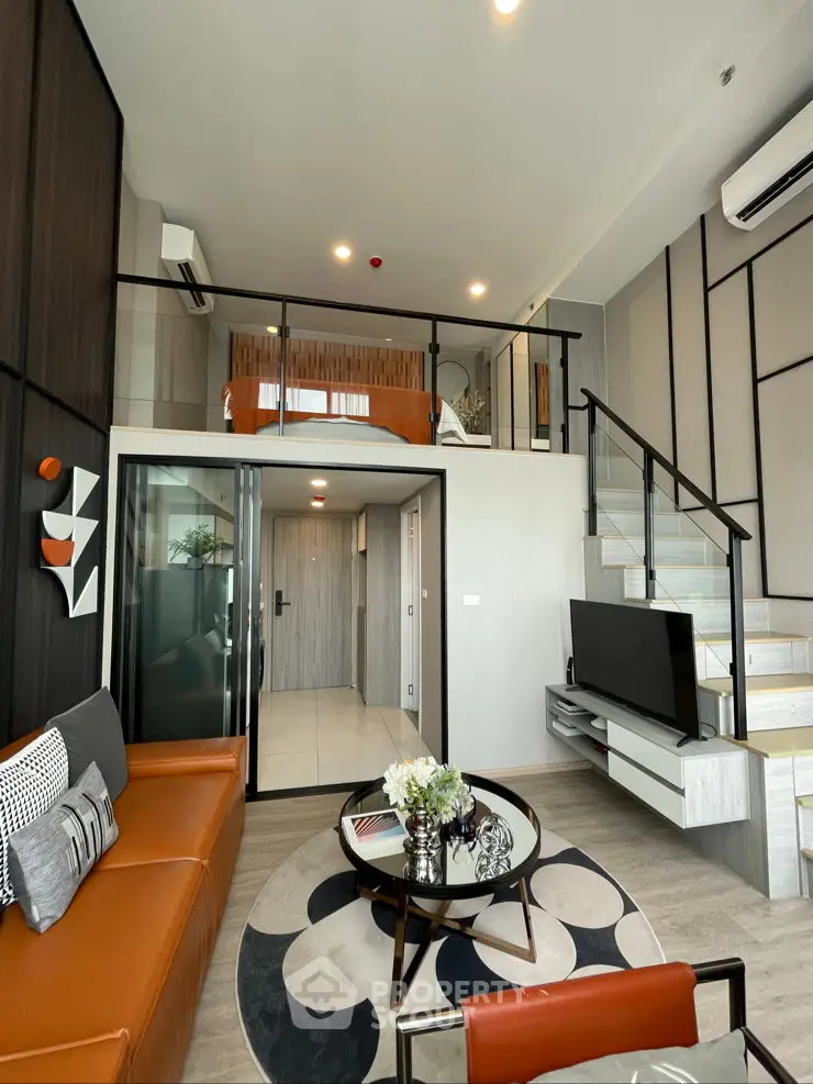 Modern loft-style living room with mezzanine bedroom, stylish decor, and open layout.