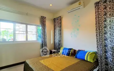 Cozy bedroom with air conditioning and vibrant decor