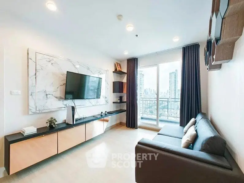 Modern living room with city view, sleek furniture, and large windows in a high-rise apartment.