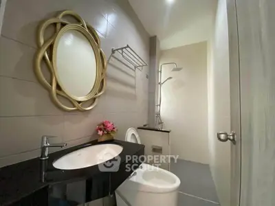 Modern bathroom with elegant mirror and sleek fixtures