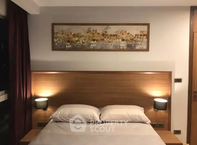 Cozy bedroom with modern wooden headboard and elegant wall art