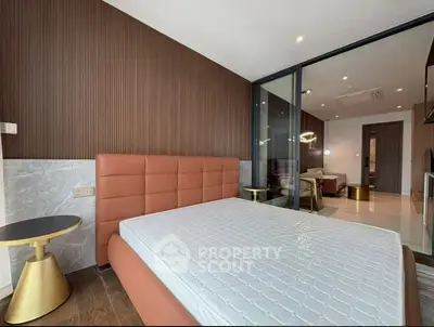 Modern bedroom with stylish decor and open layout in luxury apartment