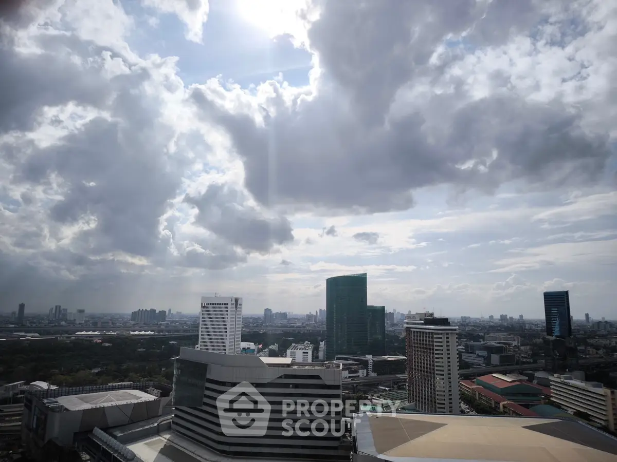 Stunning cityscape view with modern skyscrapers under dramatic cloudy sky