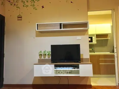 Modern living room with wall-mounted TV and stylish shelving