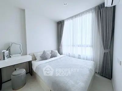 Modern bedroom with elegant decor and natural light