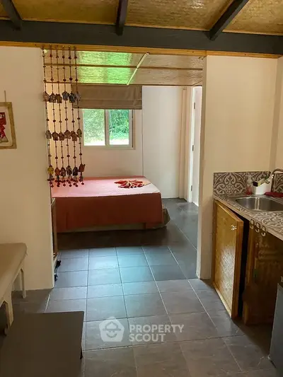 Cozy bedroom with natural light and decorative elements in a charming home.