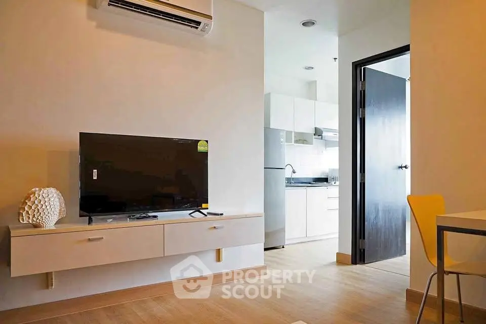 Modern apartment interior with sleek kitchen and cozy living area