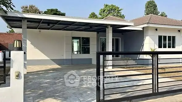 Charming single-story home with spacious driveway and modern exterior design.