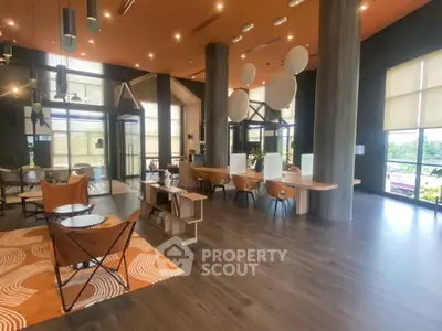 Modern living room with stylish decor and large windows
