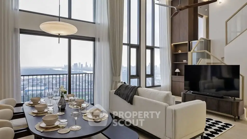 Luxurious living room with stunning city view, high ceilings, and elegant dining area in modern apartment.