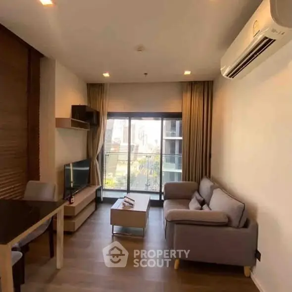 Modern living room with cozy sofa and large window view