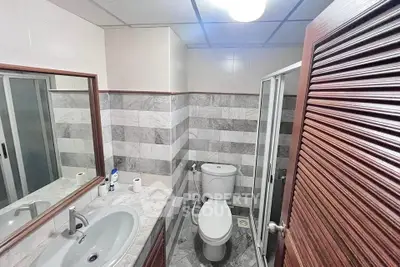 Modern bathroom with sleek design featuring a glass shower and stylish vanity.
