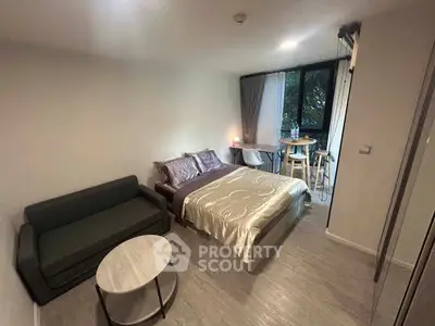 Cozy studio apartment with modern furnishings and natural light