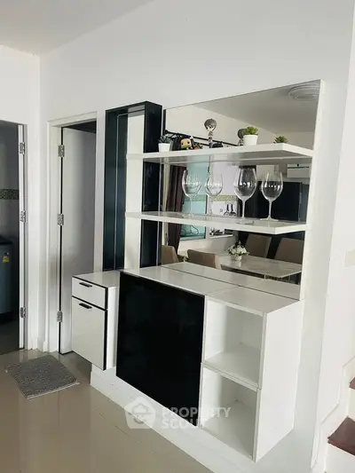 Modern interior with sleek shelving and elegant decor in a stylish living space.