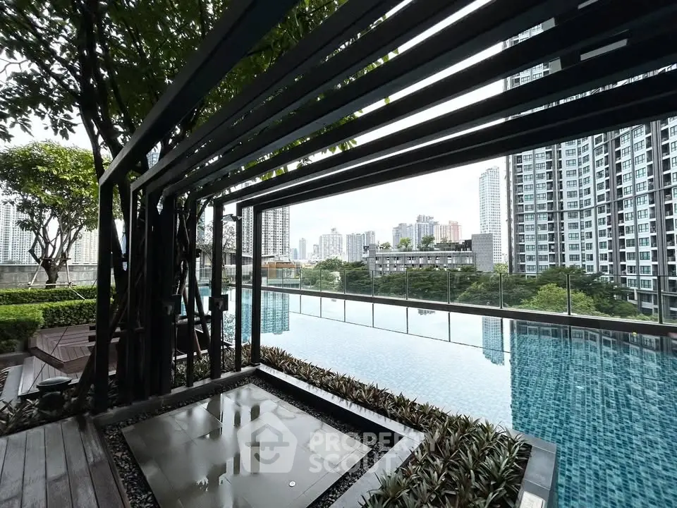 Luxurious rooftop pool with stunning city skyline view in modern high-rise building.