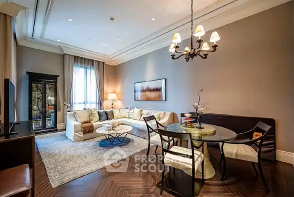 Elegant living room with cozy seating and stylish dining area in luxury apartment.