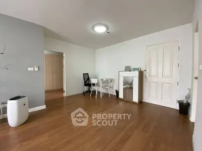 Spacious modern living room with wooden flooring and stylish furniture