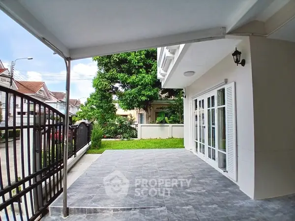 Spacious patio with garden view in modern residential property