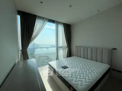 Modern bedroom with stunning city view and natural light
