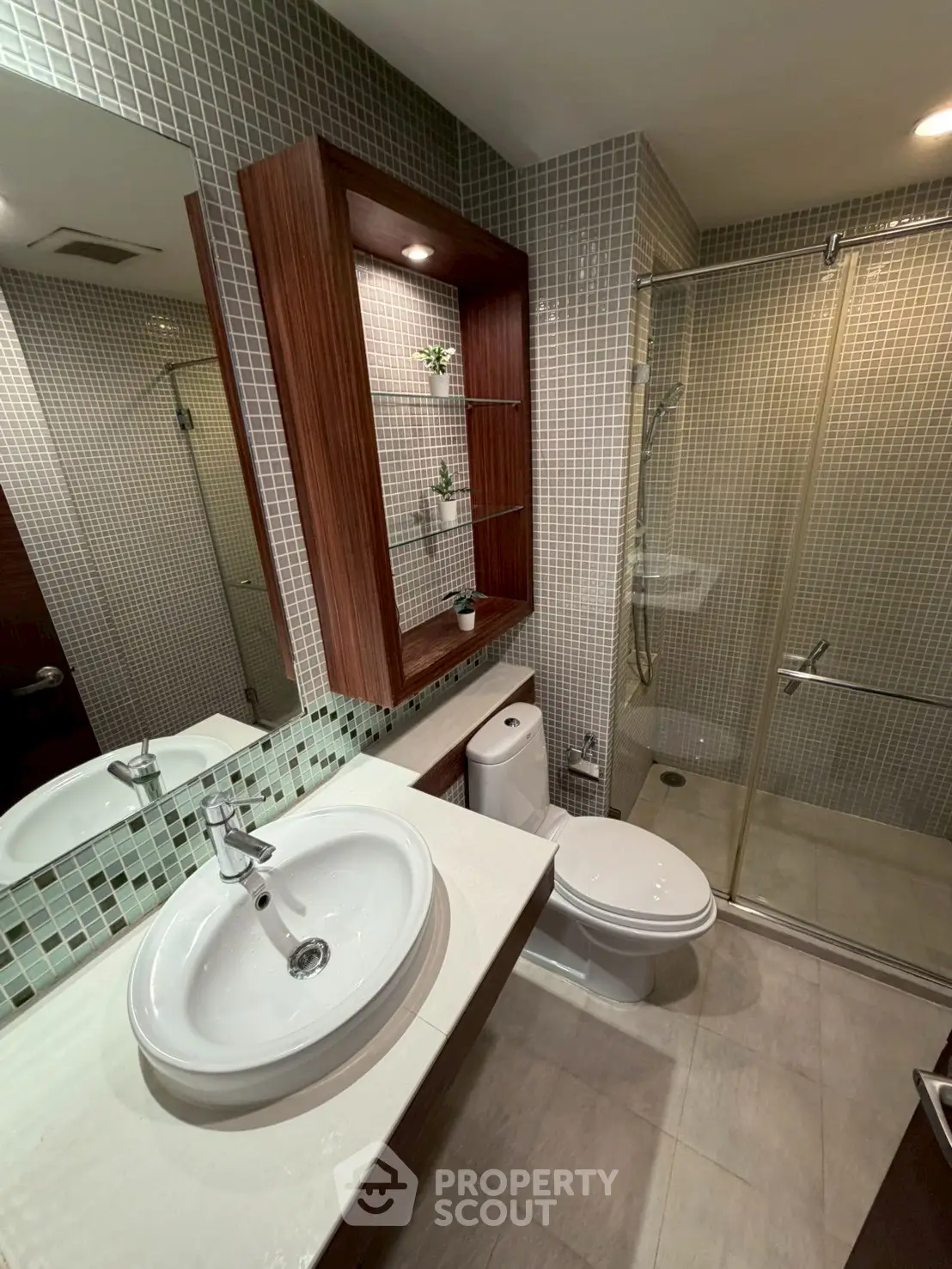Modern bathroom with glass shower and stylish tile design
