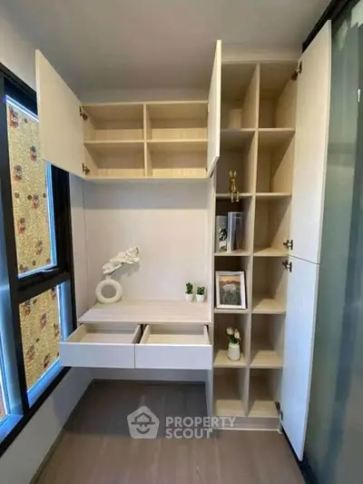 Modern study room with built-in shelving and natural light