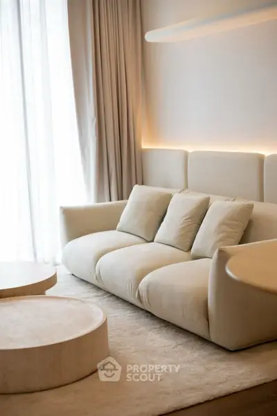 Luxurious modern living room with plush sofa and elegant lighting