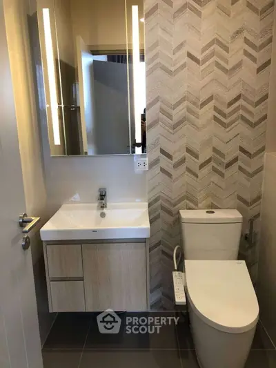 Modern bathroom with sleek fixtures and stylish tile design