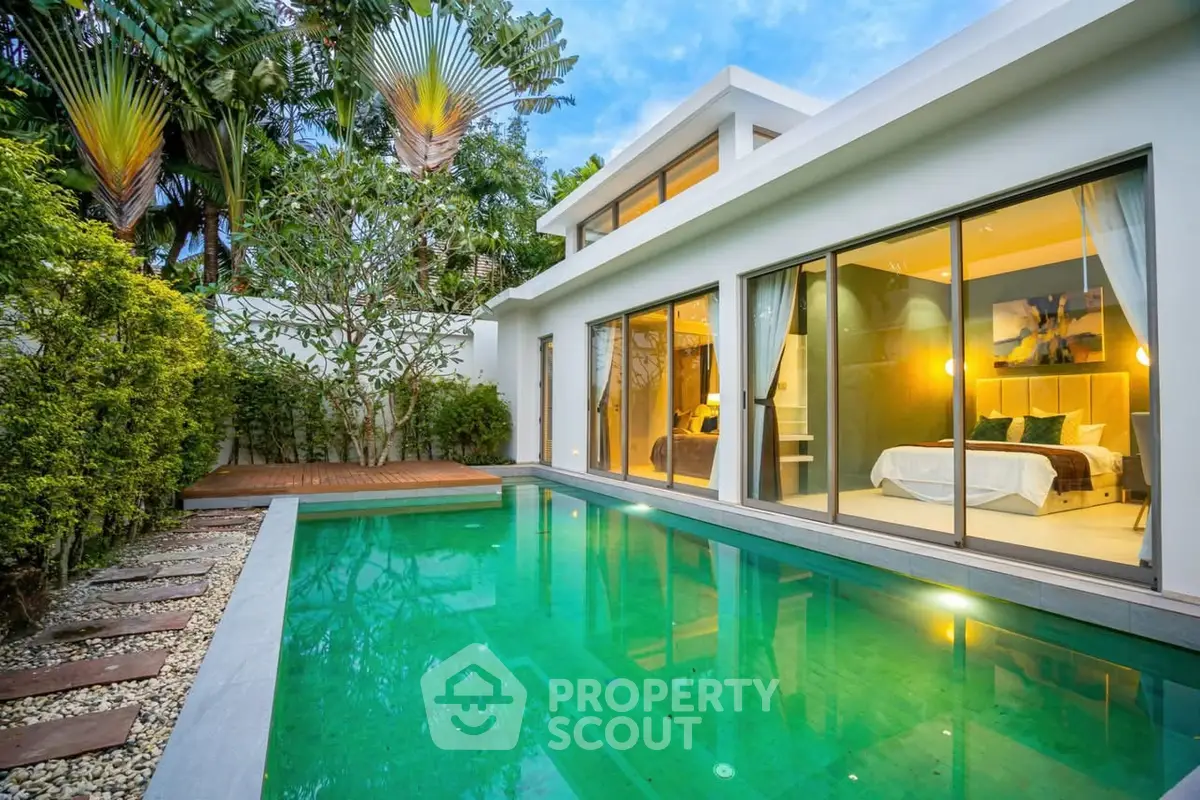 Luxurious modern villa with private pool and lush garden view