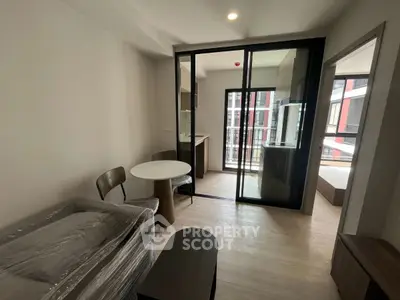 Modern apartment interior with open layout and balcony view