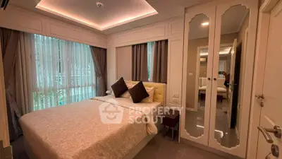 Elegant bedroom with large windows and mirrored wardrobe in modern apartment