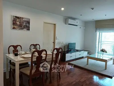 Spacious living room with elegant dining area and modern decor