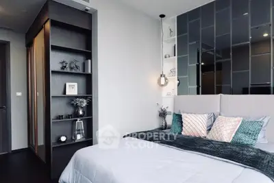 Modern bedroom with stylish decor and elegant shelving in a contemporary apartment.