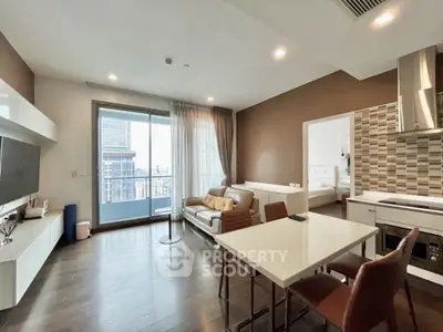 Modern open-plan living room with city view and stylish kitchen