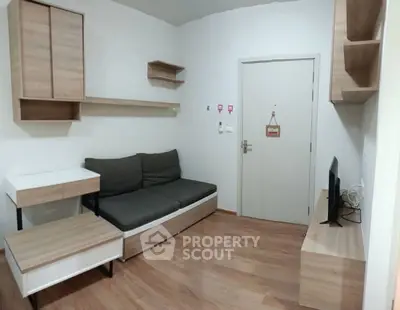 Modern living room with sleek wooden furniture and cozy sofa