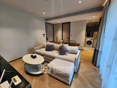 Modern living room with elegant furniture and open kitchen layout