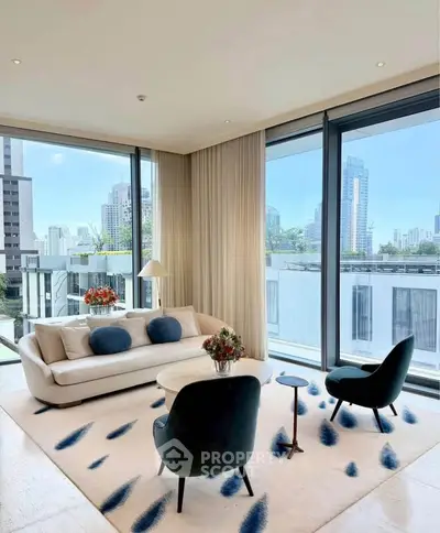 Luxurious modern living room with floor-to-ceiling windows and city view, featuring elegant furniture and stylish decor.