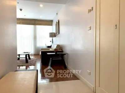 Cozy living room with modern decor and natural light in a stylish apartment.