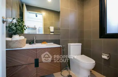 Modern bathroom with sleek design and elegant fixtures in a contemporary home.
