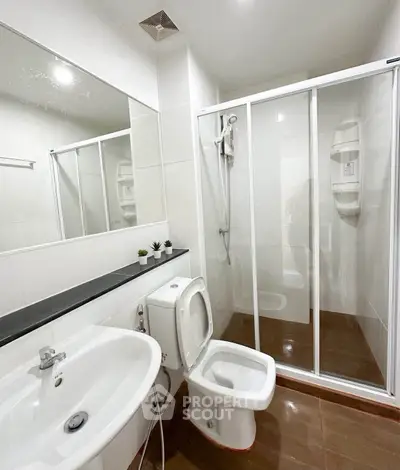 Modern bathroom with sleek shower enclosure and elegant fixtures