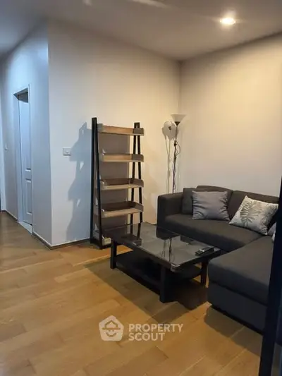 Modern living room with sleek furniture and wooden flooring