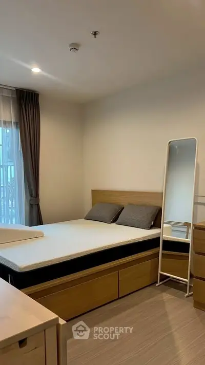 Modern bedroom with wooden furniture and natural light