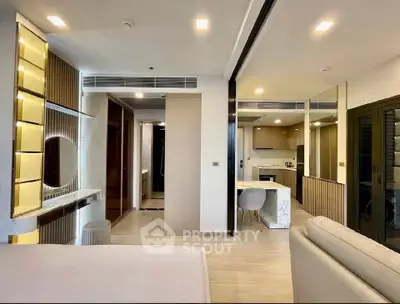 Modern open-plan living room with stylish kitchen and elegant decor