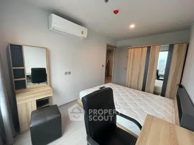 Modern bedroom with sleek furniture and air conditioning in a stylish apartment.